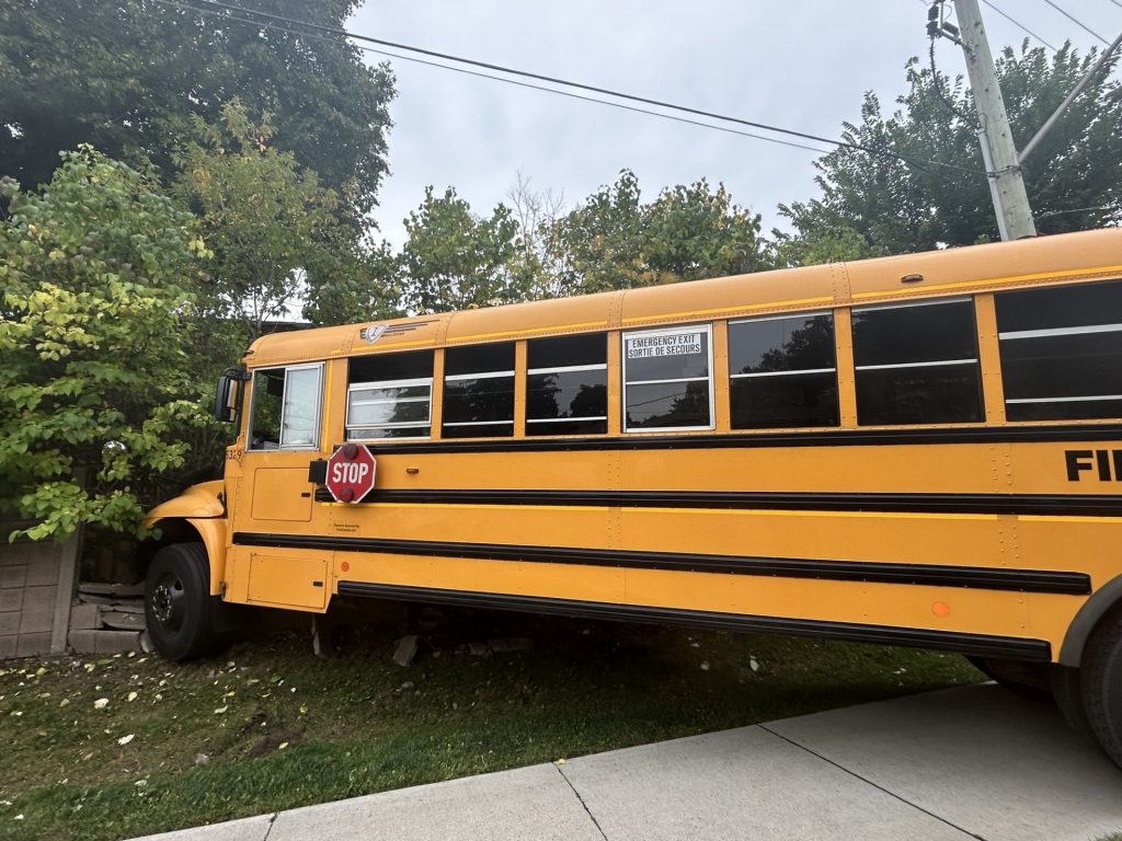 School Bus Crashes Through Fence; No Injuries Reported